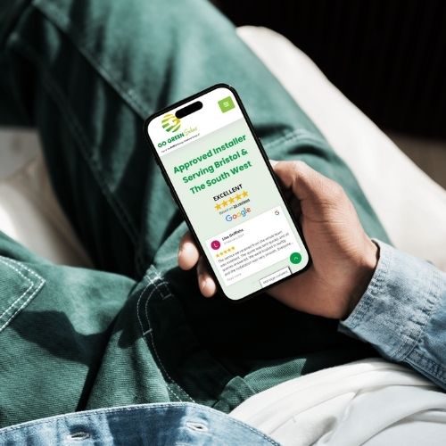 Man looking at the go green solar website on his phone
