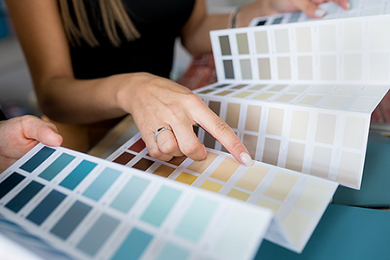 painting-and-decorating-colour-swatch painter and decorator looking at paint swatches