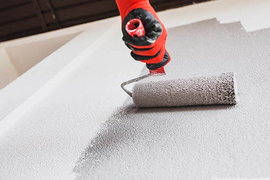 painting-and-decorating-roller person using a paint roller